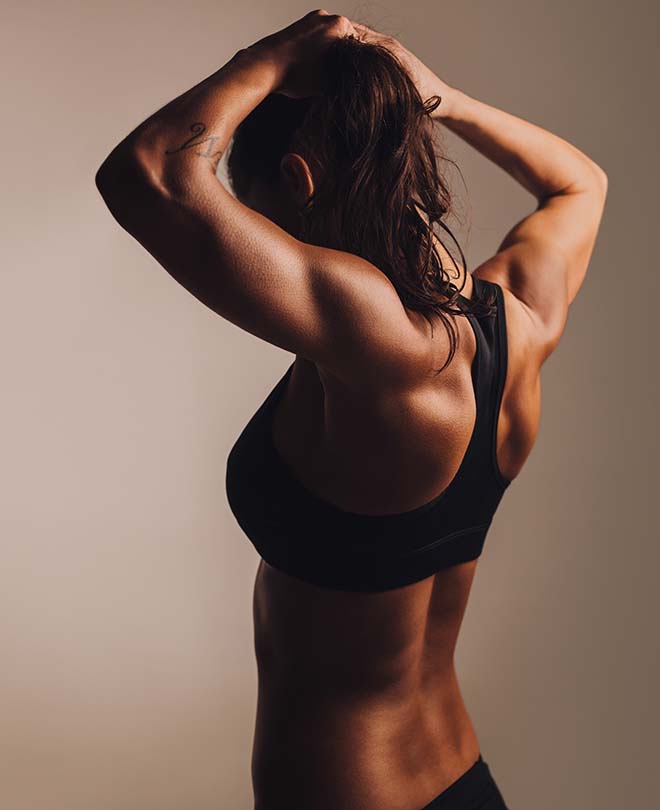FRXS-Fitness female showing muscular back